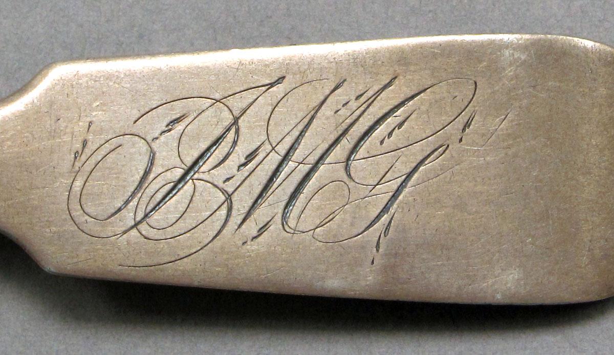 1962.0240.569 Silver spoon engraving