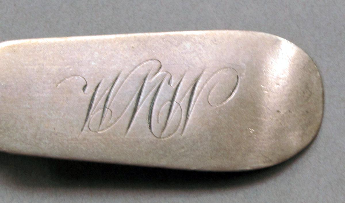 1962.0240.571 Silver spoon engraving