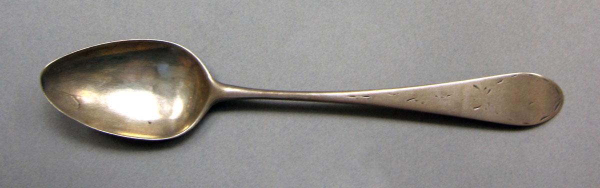 1962.0240.573 Silver spoon upper surface