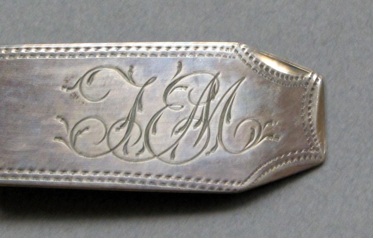 1962.0240.576 Silver spoon engraving