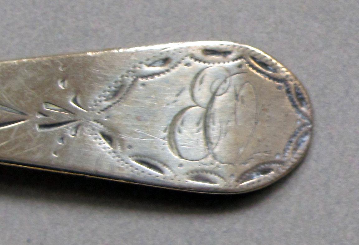 1962.0240.582 Silver spoon engraving