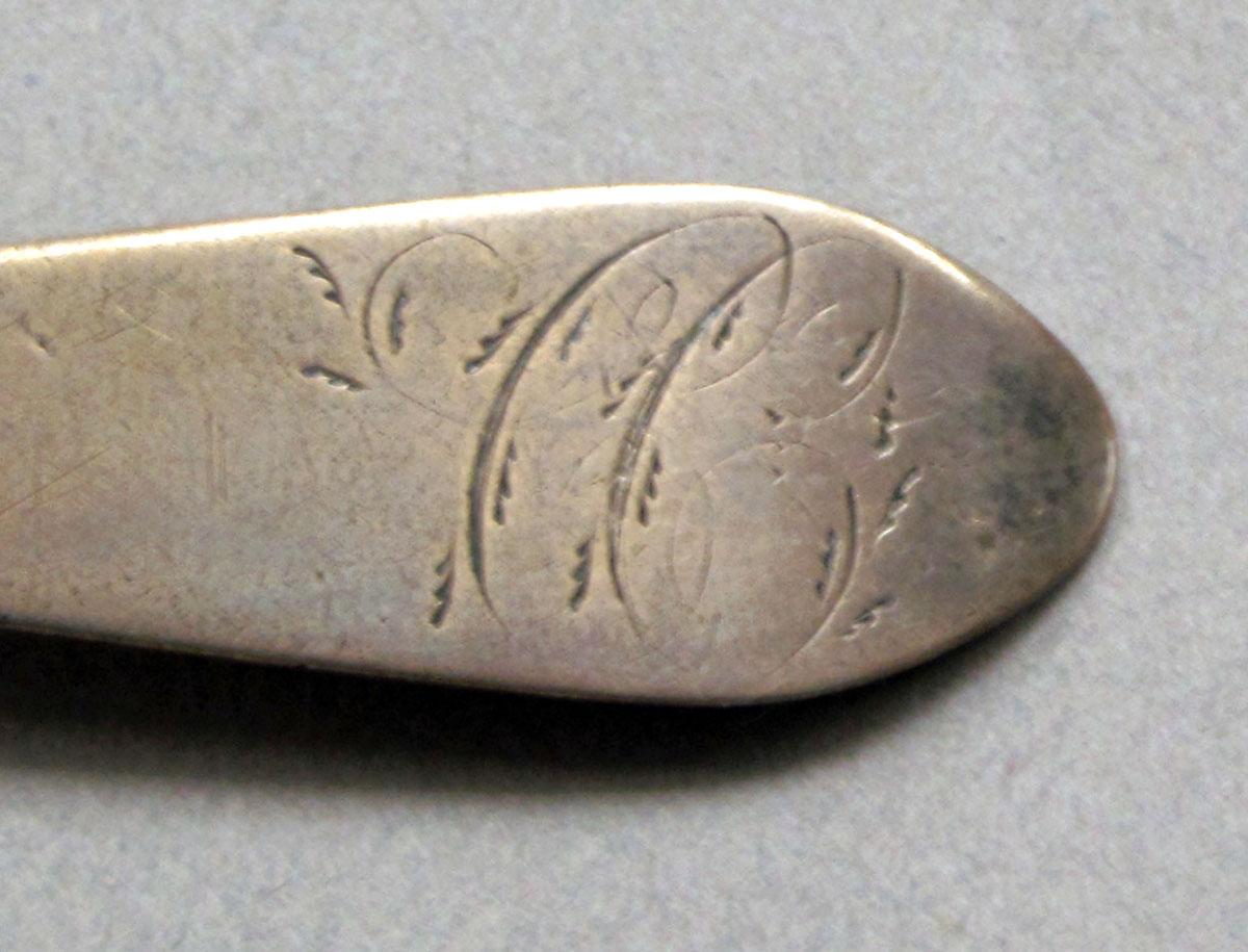1962.0240.583 Silver spoon engraving
