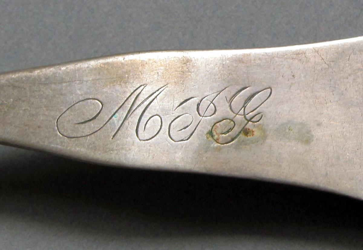 1962.0240.586 Silver spoon engraving