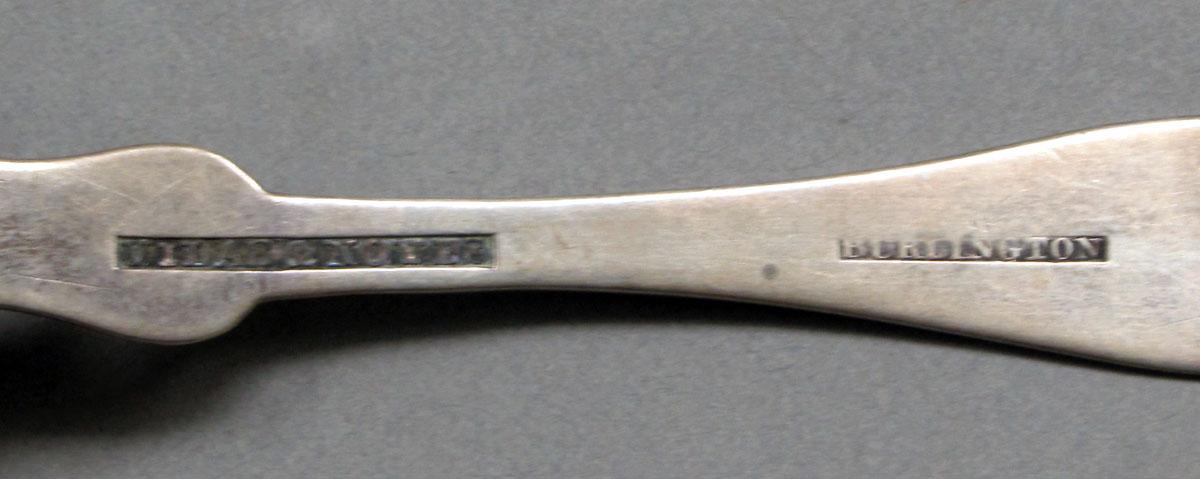 1962.0240.586 Silver spoon mark