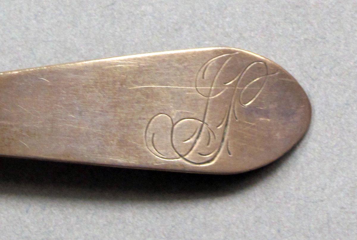1962.0240.587 Silver spoon engraving