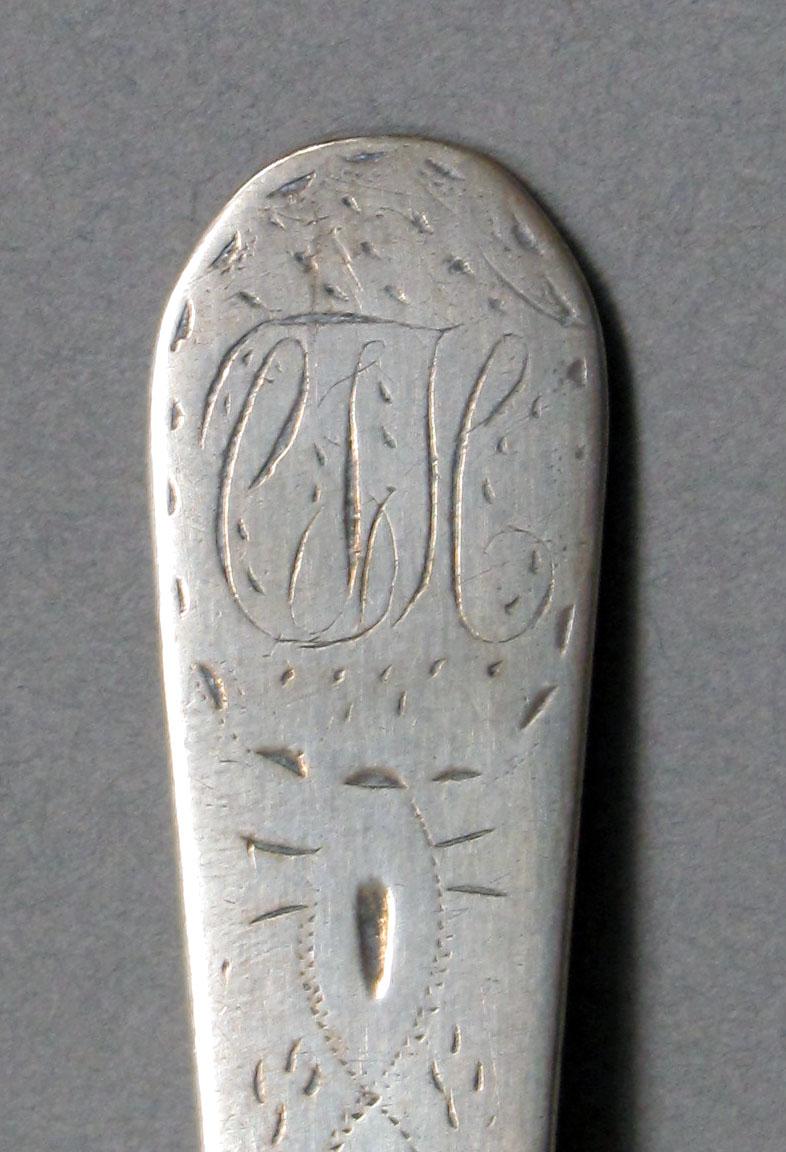 1962.0240.588 Silver spoon engraving