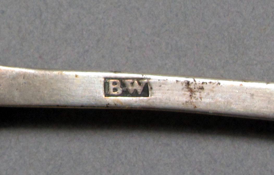 1962.0240.590 Silver spoon mark