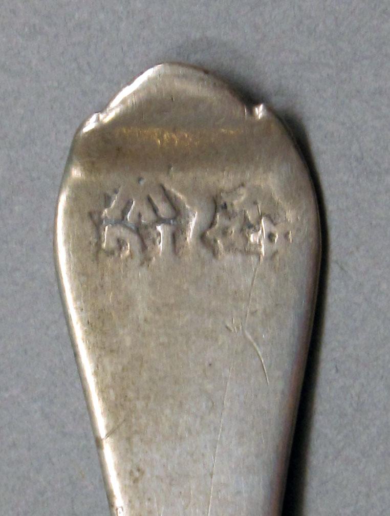 1962.0240.594 Silver spoon mark