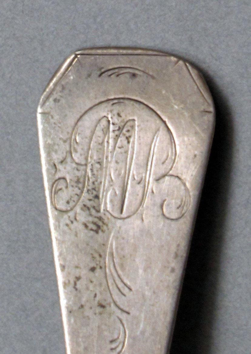 1962.0240.596 Silver spoon engraving