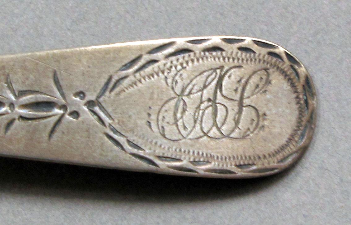 1962.0240.599 Silver spoon engraving