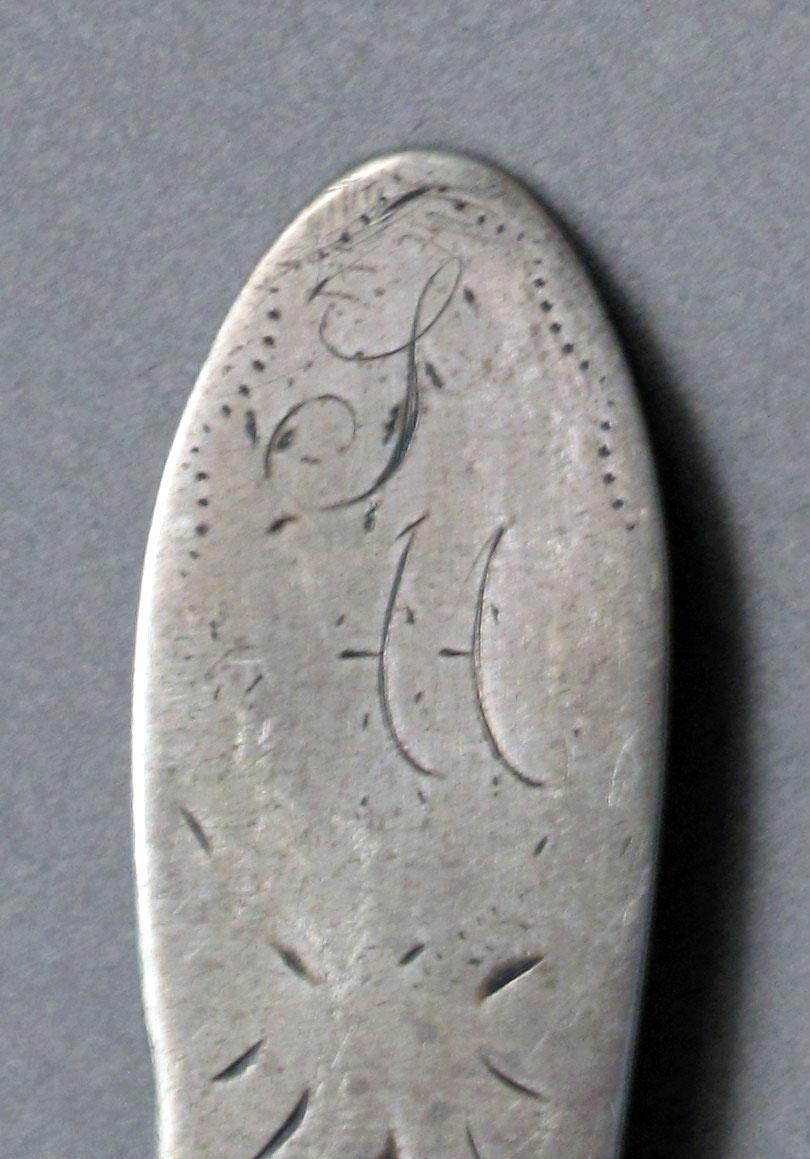 1962.0240.603 Silver spoon engraving