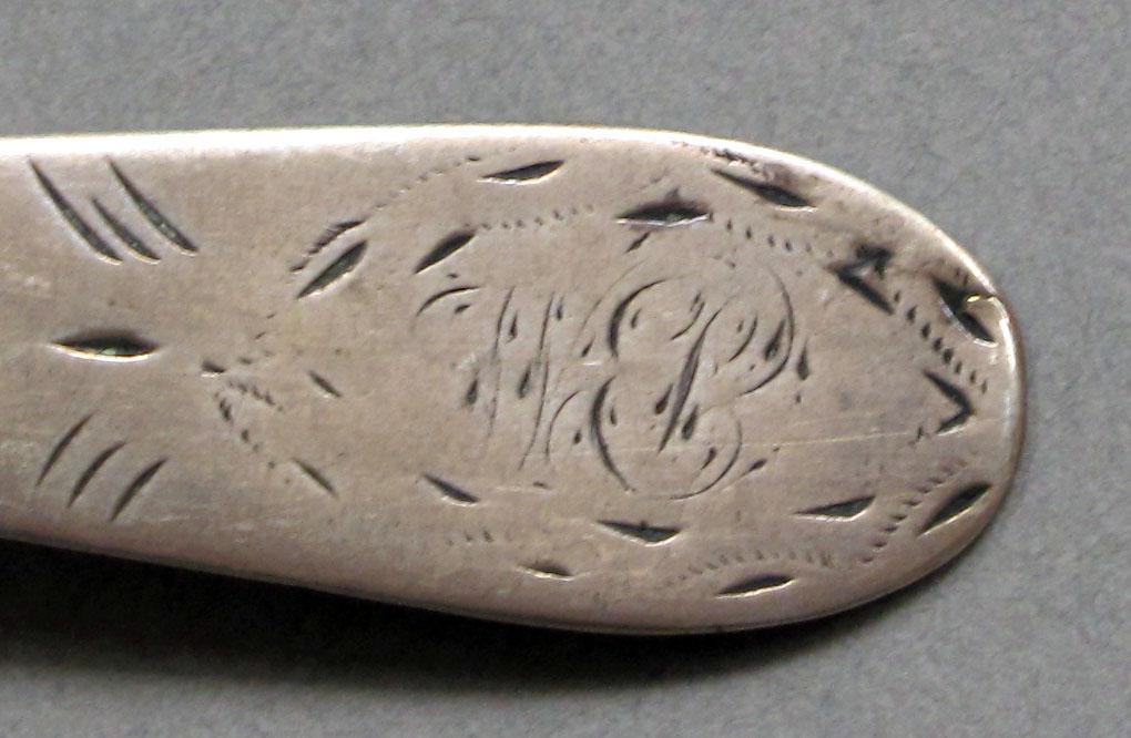 1962.0240.604 Silver spoon engraving