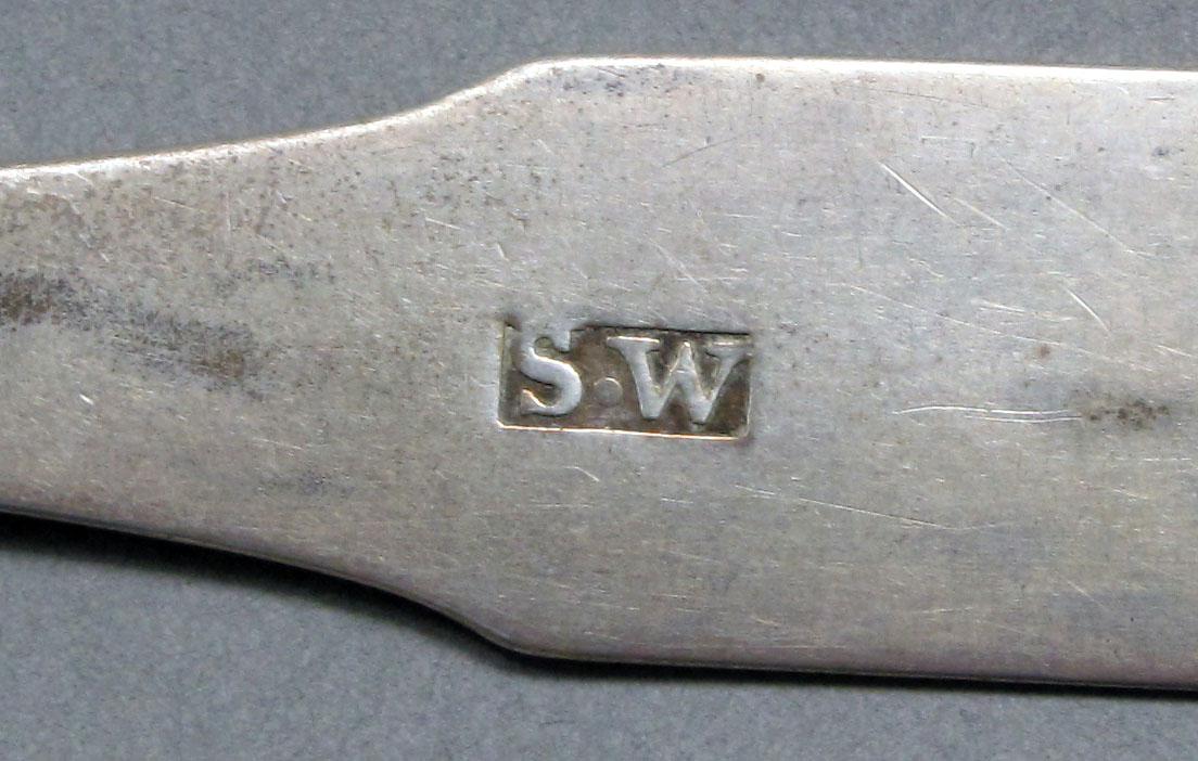 1962.0240.608 Silver spoon mark