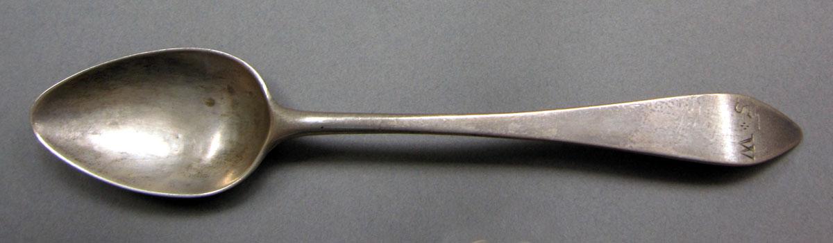 1962.0240.609 Silver spoon upper surface