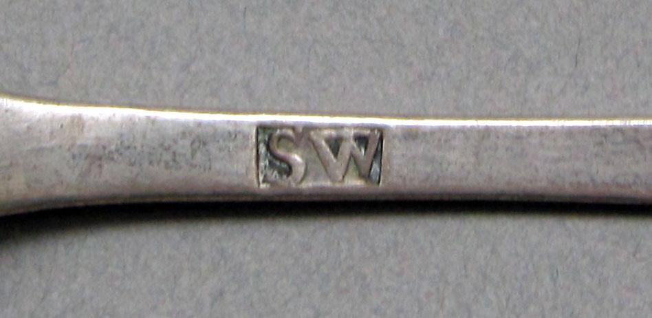 1962.0240.609 Silver spoon mark