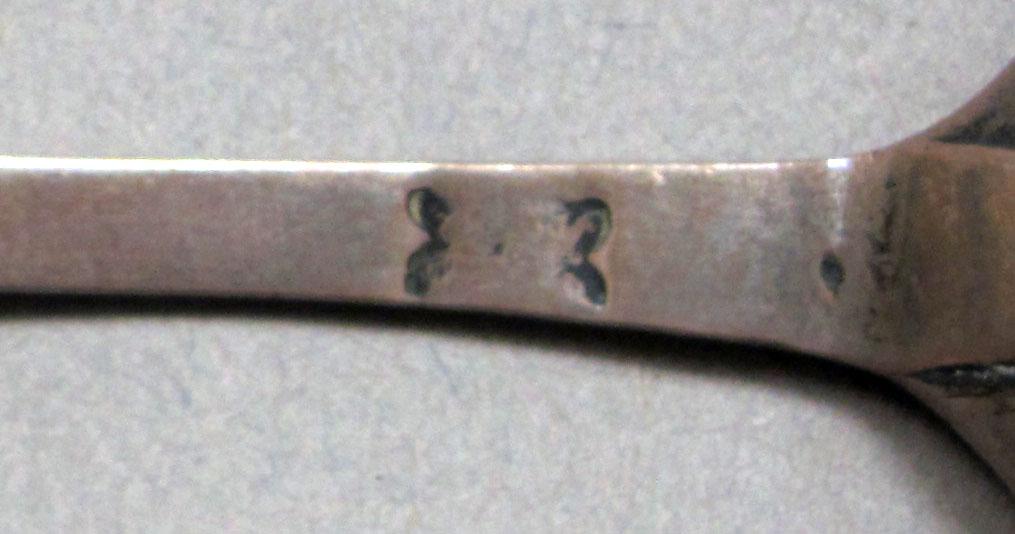 1962.0240.610 Silver spoon mark