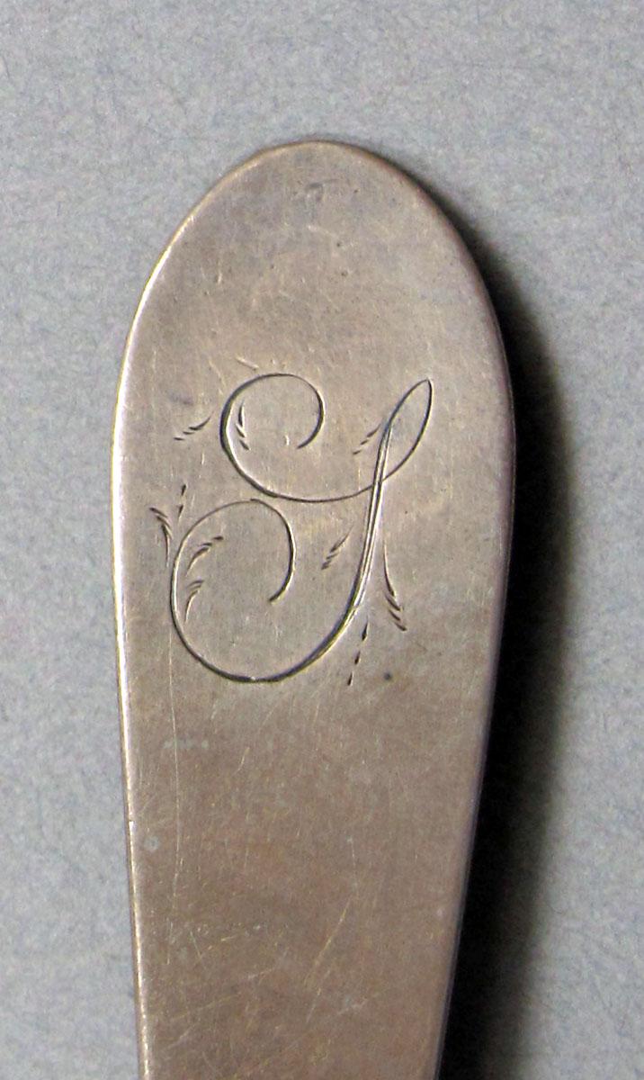 1962.0240.614 Silver spoon engraving