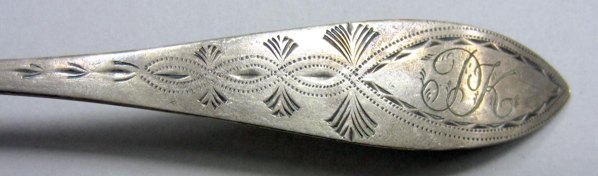 1962.0240.618 Silver spoon engraving