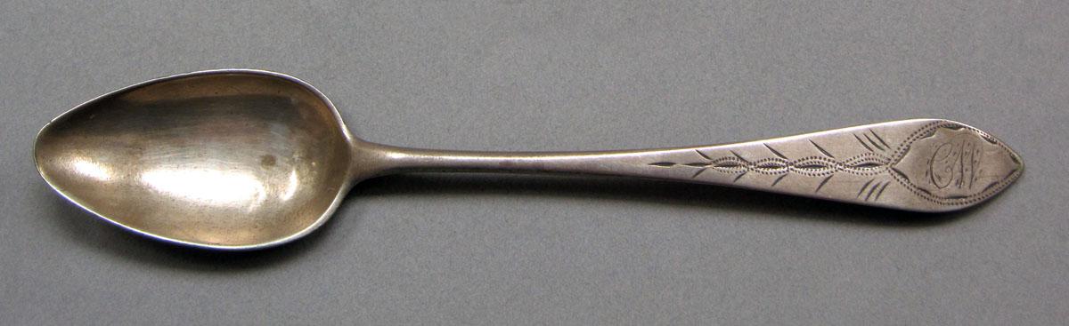 1962.0240.624 Silver spoon upper surface