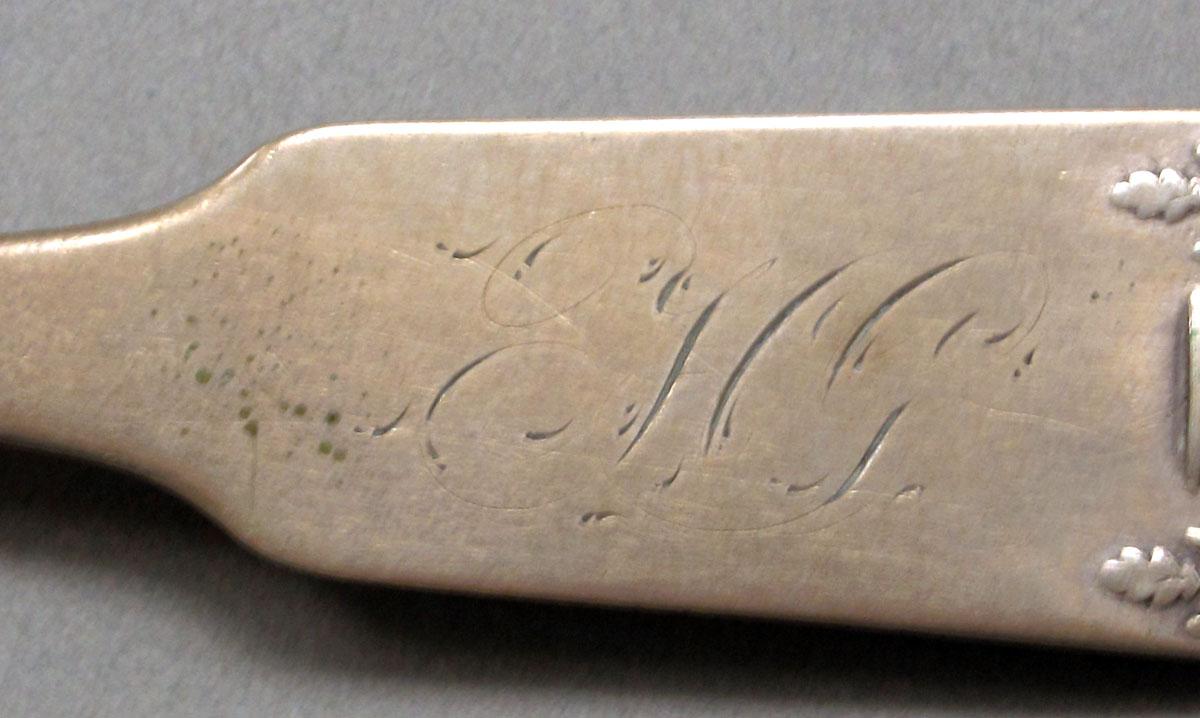 1962.0240.625 Silver spoon engraving