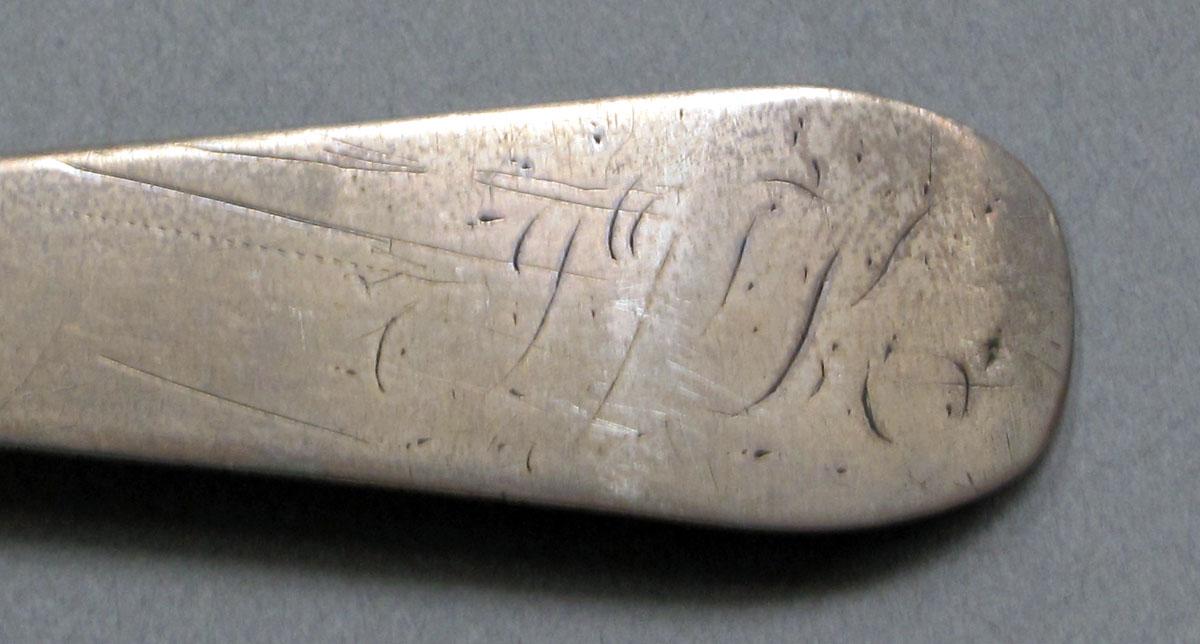 1962.0240.628 Silver spoon engraving