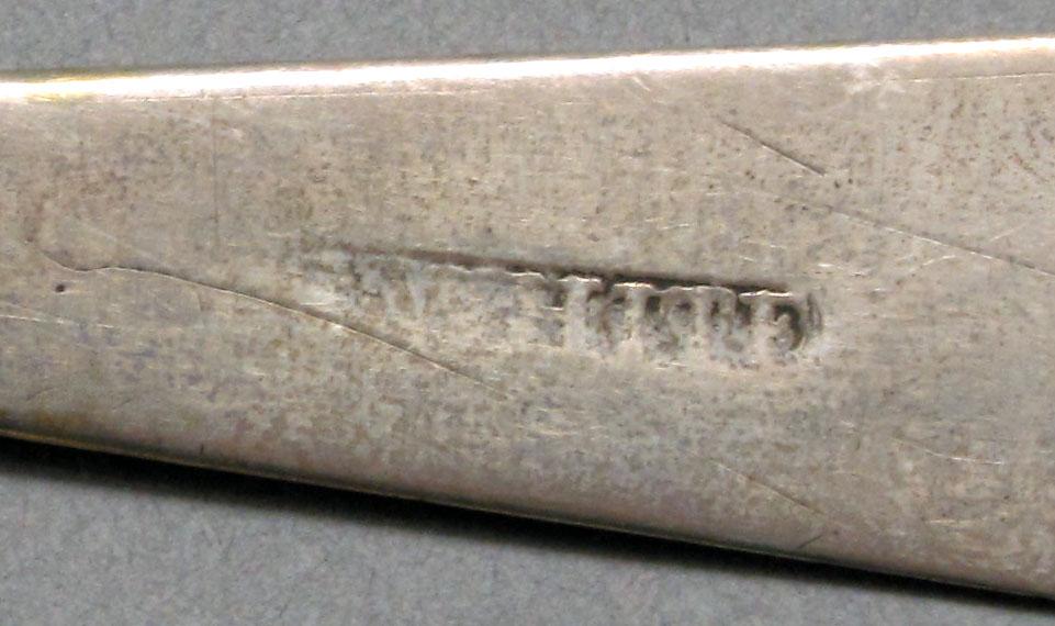 1962.0240.628 Silver spoon mark