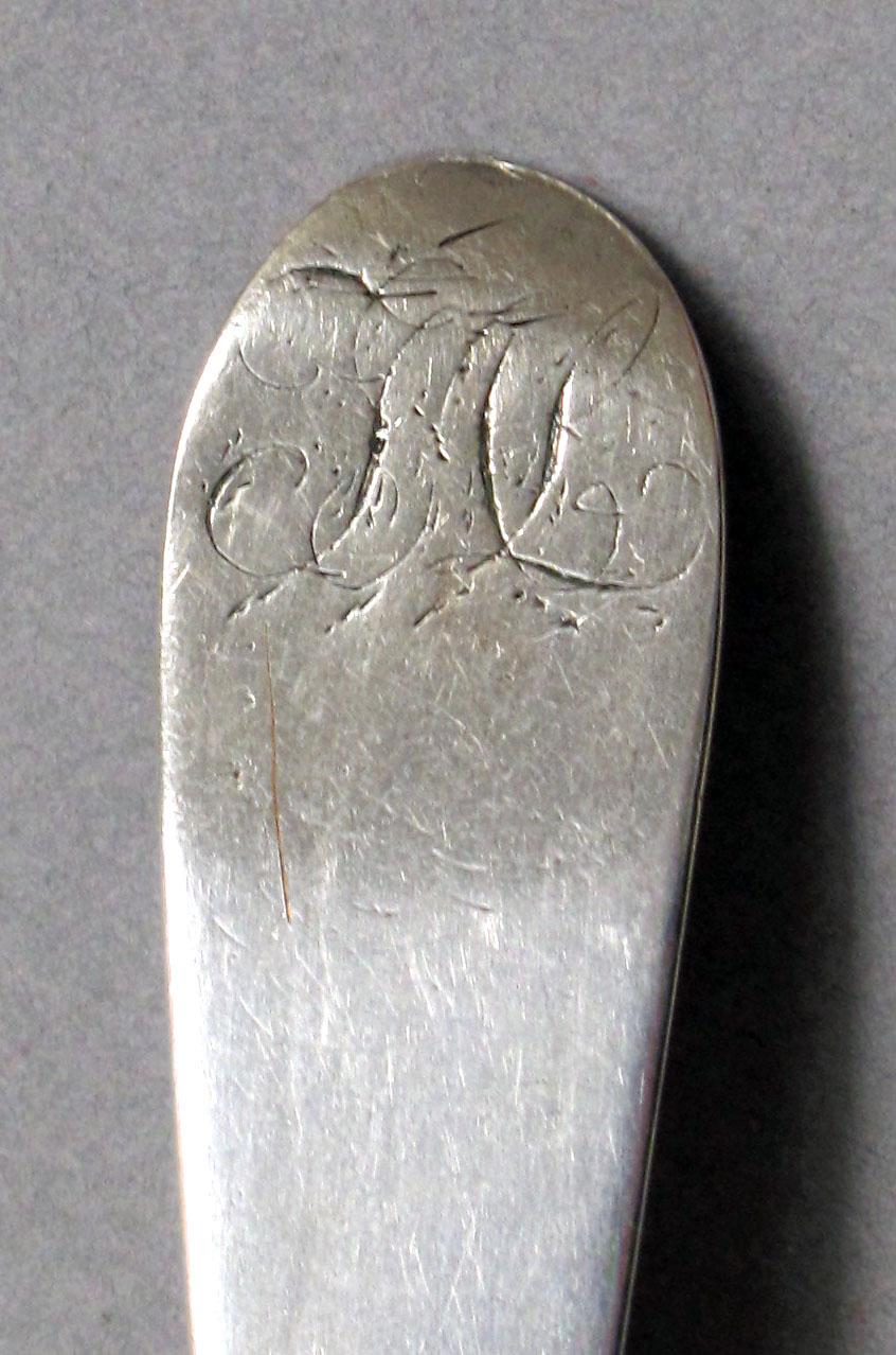 1962.0240.632 Silver spoon engraving
