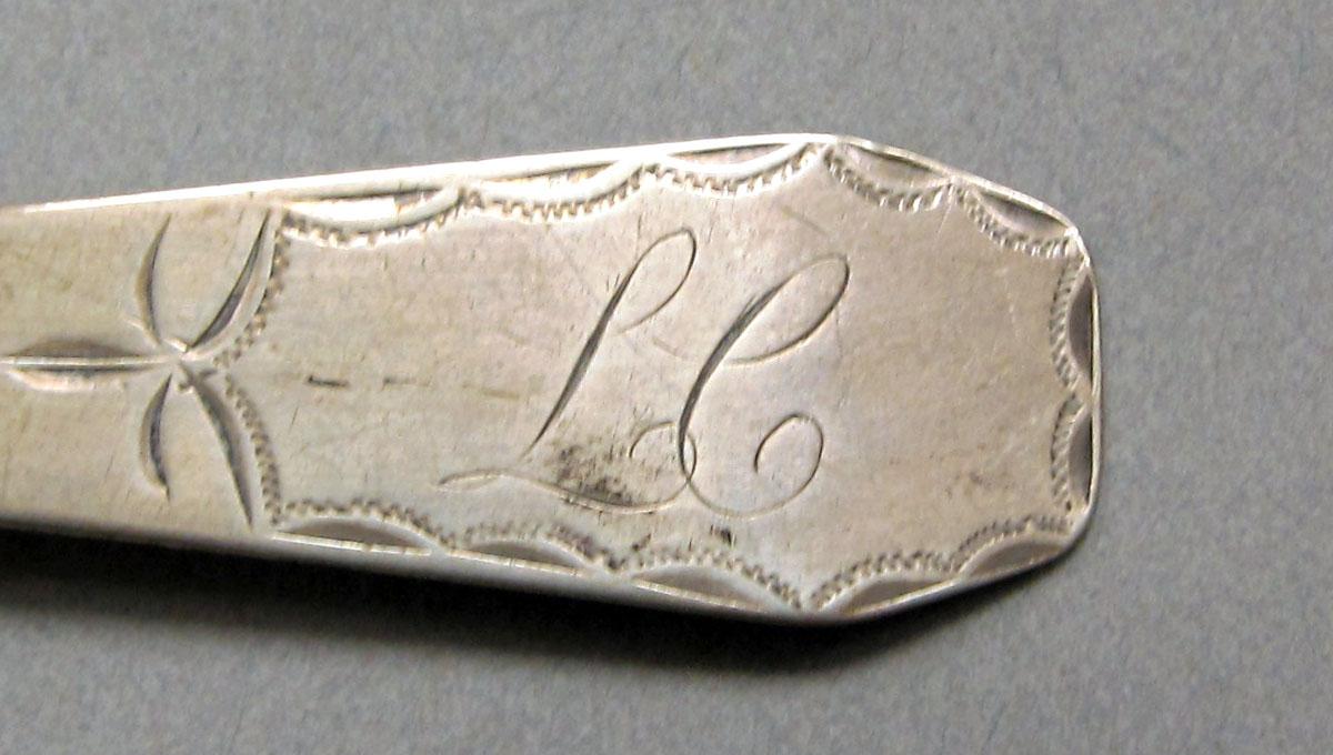 1962.0240.637 Silver spoon engraving