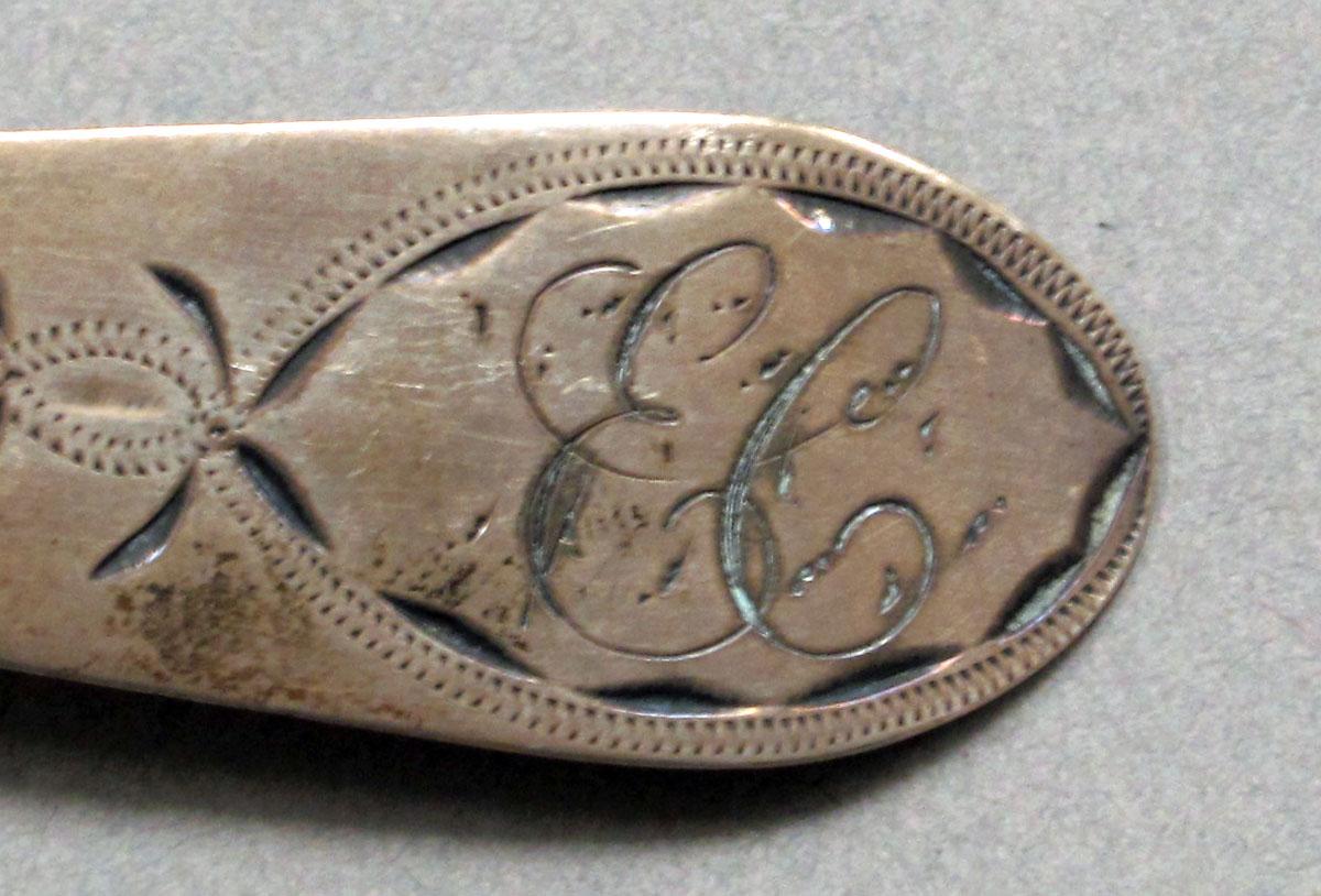 1962.0240.639 Silver spoon engraving