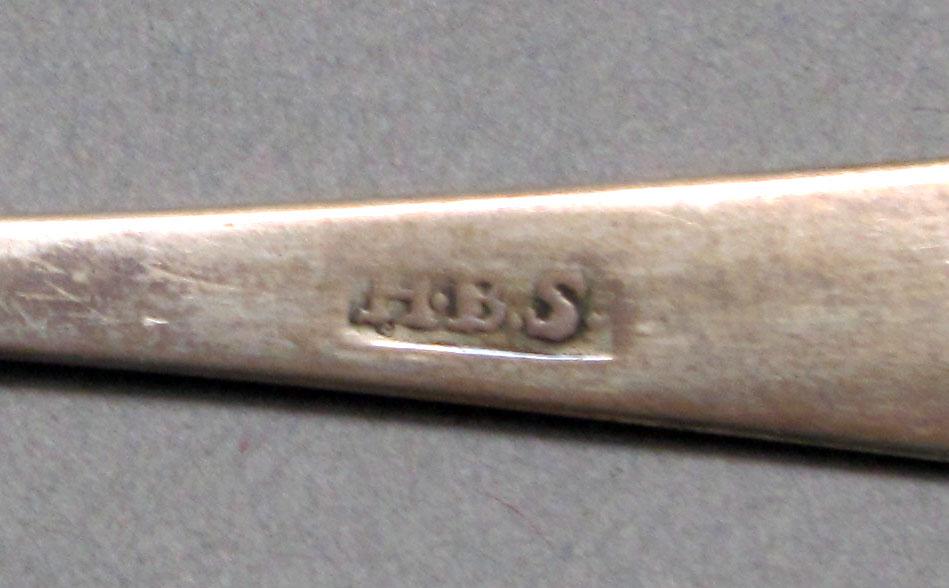 1962.0240.645 Silver spoon mark