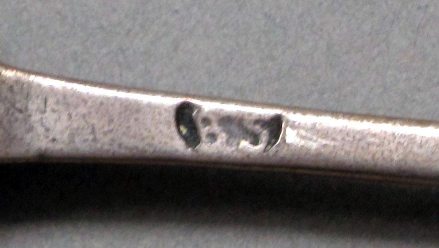 1962.0240.648 Silver spoon mark
