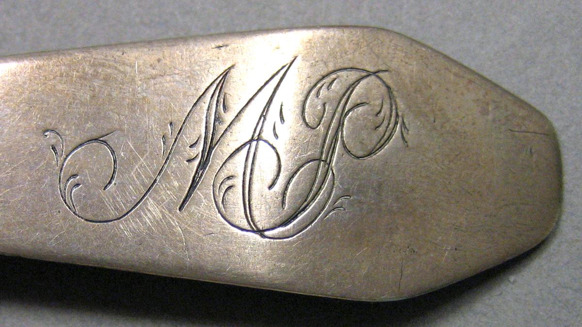 1962.0240.669 Silver Spoon engraving