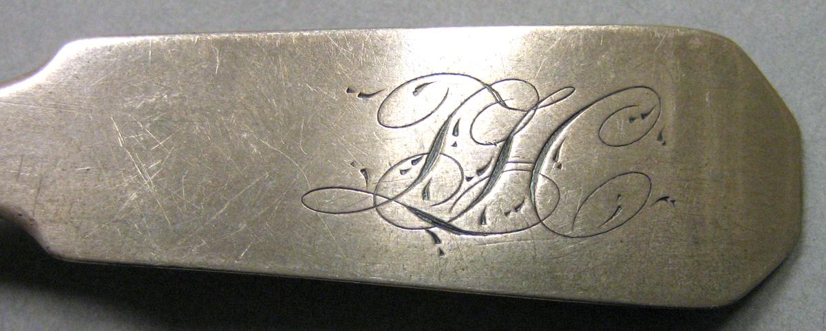 1962.0240.703 Silver Spoon engraving