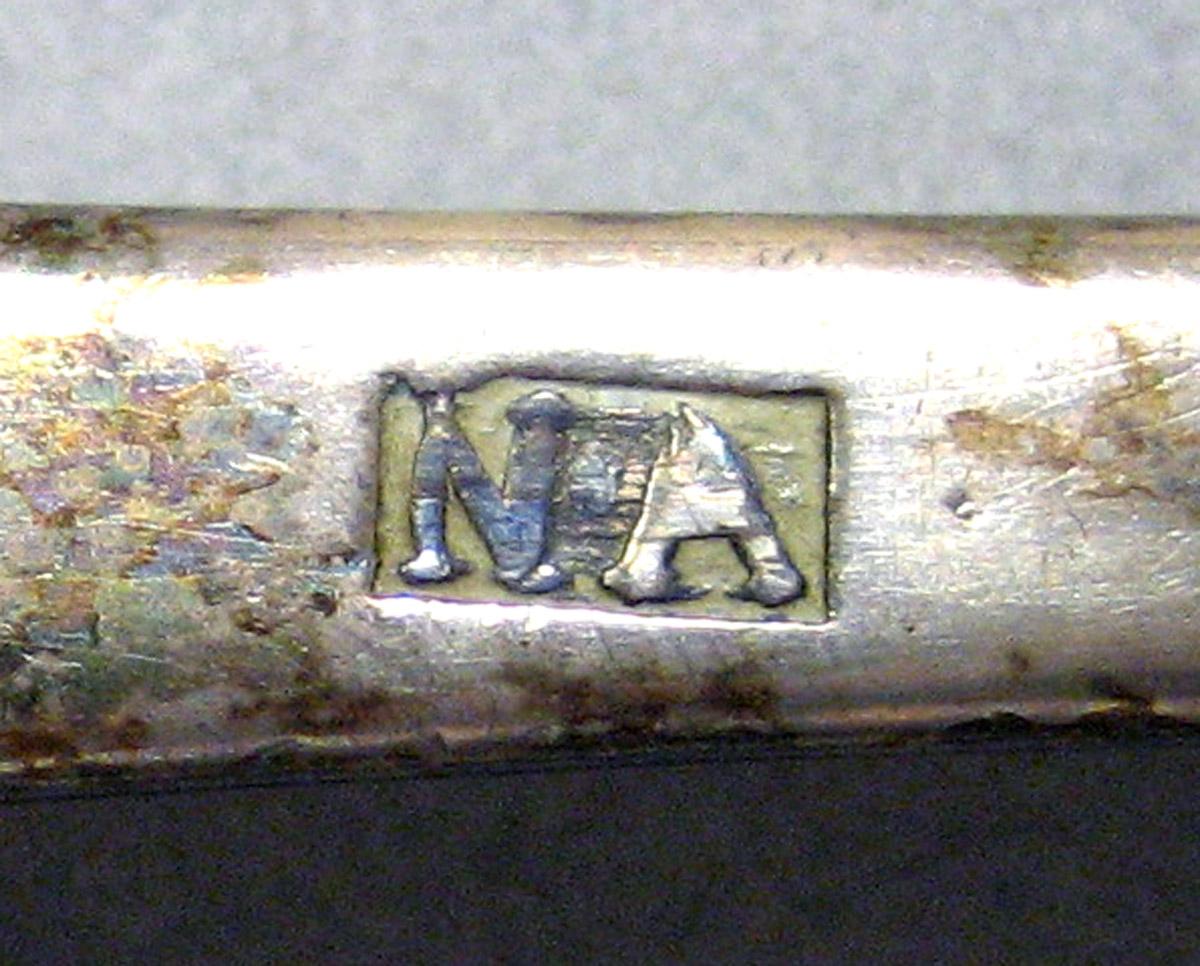 1962.0240.874 Tablespoon mark