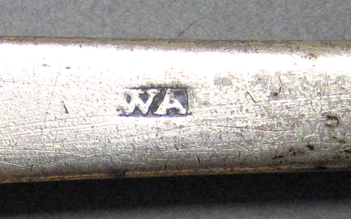 1962.0240.876 Tablespoon mark