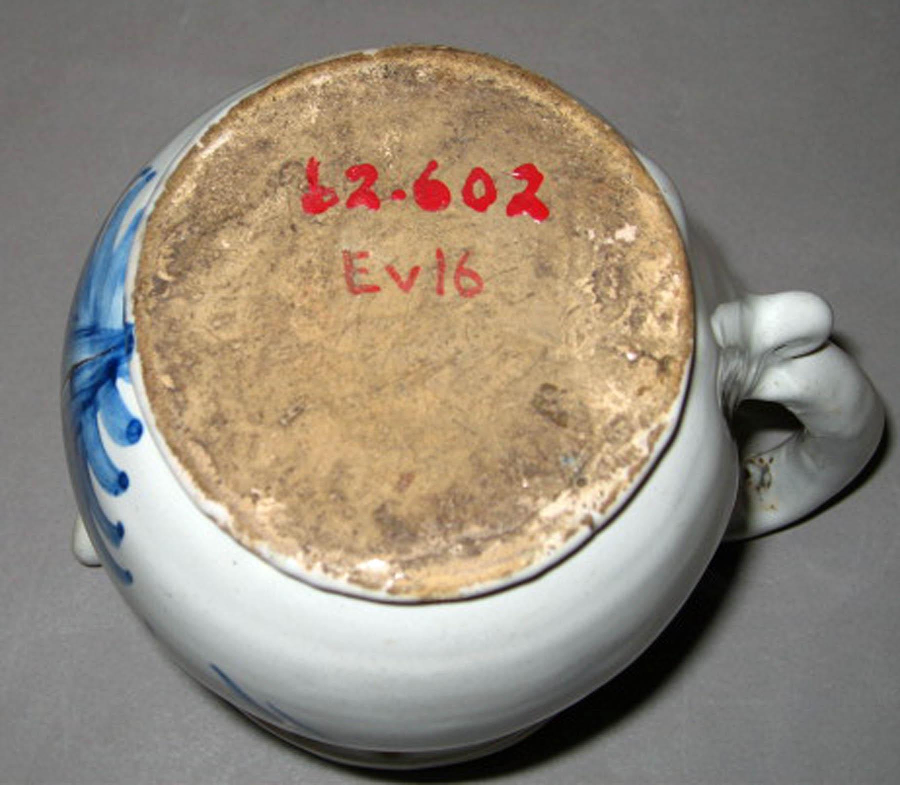 1962.0602 Tin-glazed earthenware puzzle jug (underside)