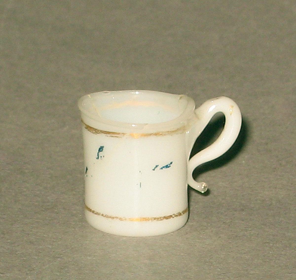 1962.0630 J Glass miniature teacup