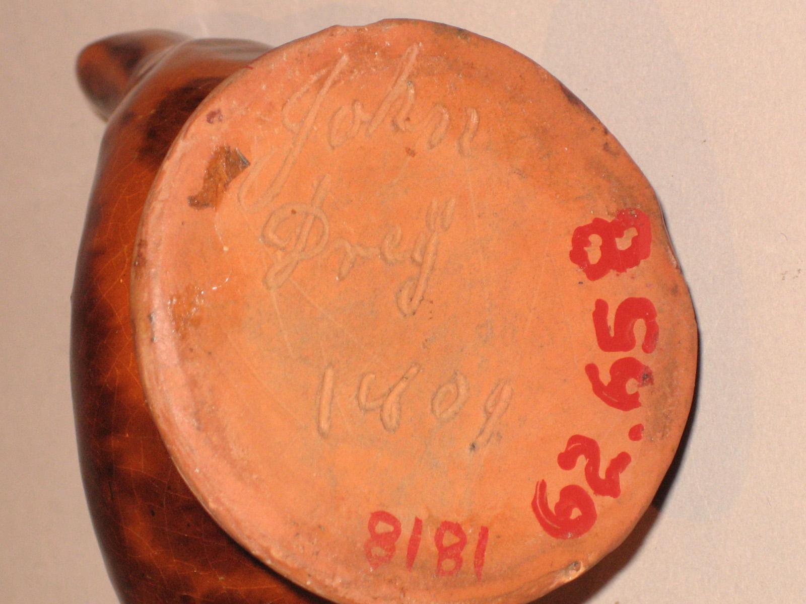 1960.0658 Whistle (inscription)