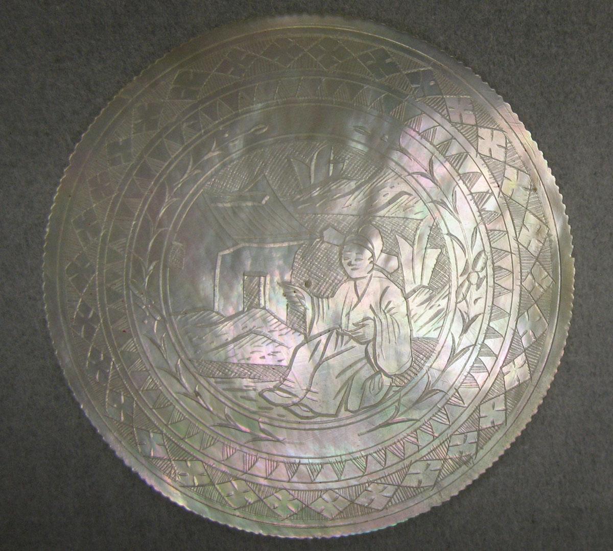 1963.0102.021 Game counter, obverse