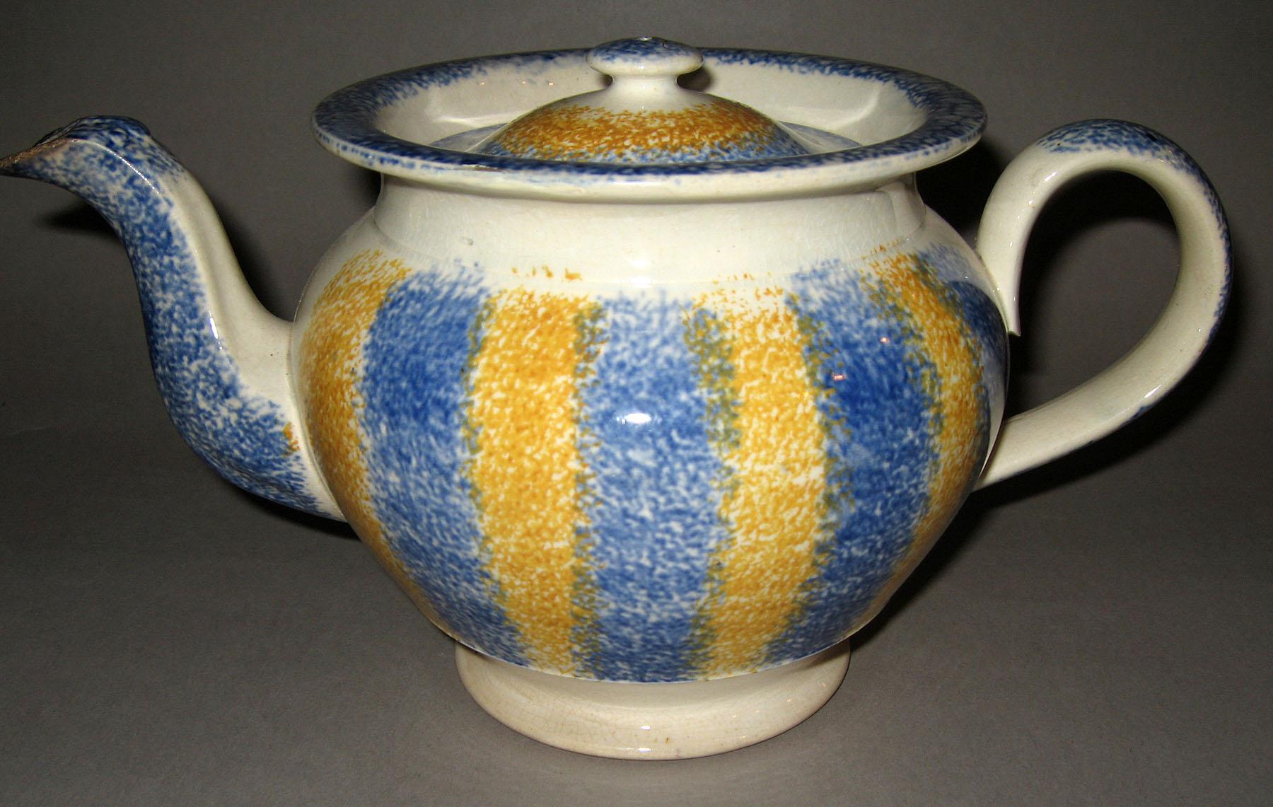 1963.0128 A, B Blue and yellow stripe spatterware teapot