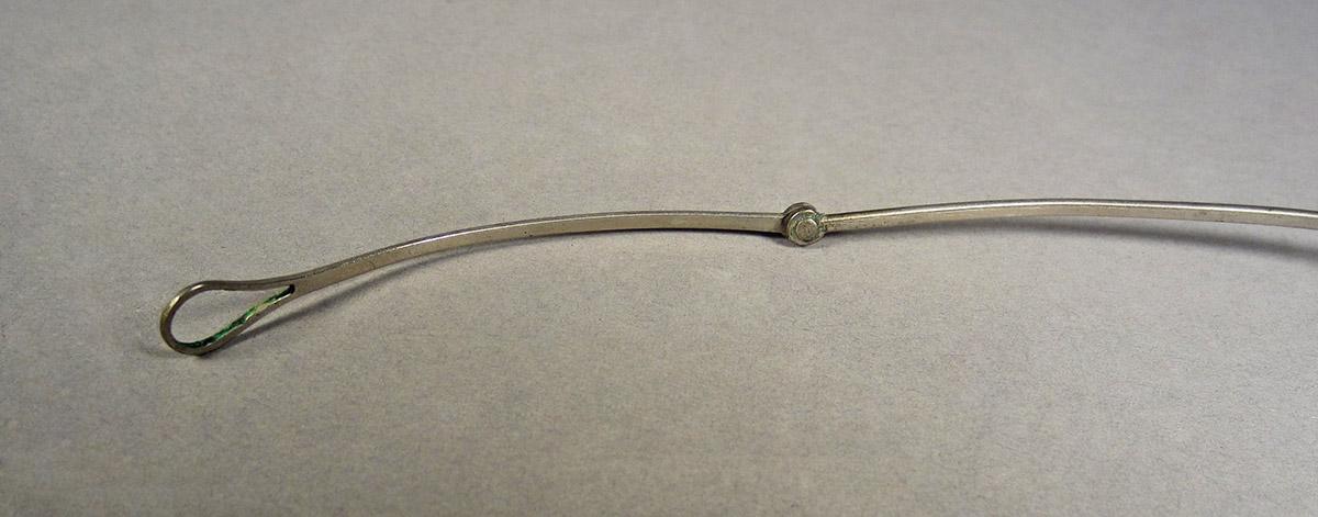 1963.0156.040 B, Eyeglasses, earpiece detail