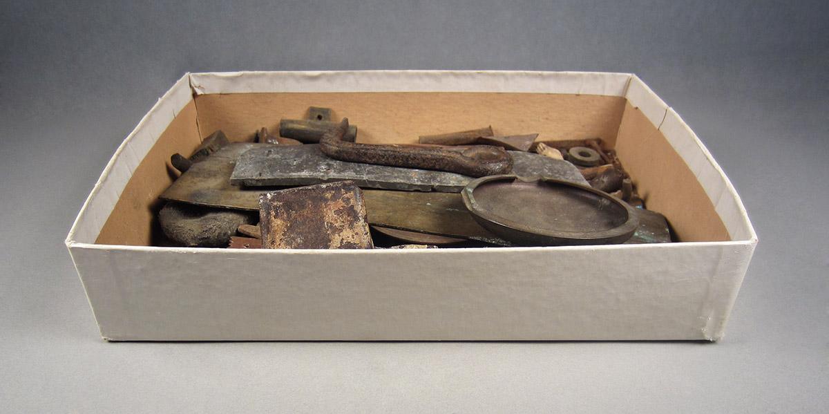 1963.0156.047, Box of scrap metal, angle 1