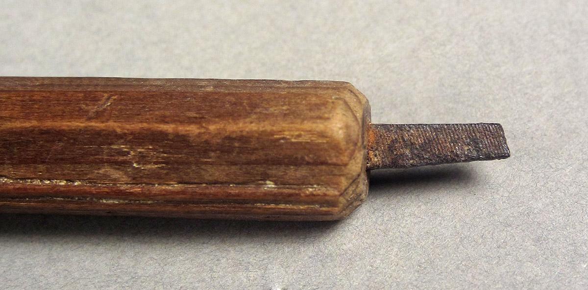 1963.0156.176, Filel, blade side 1