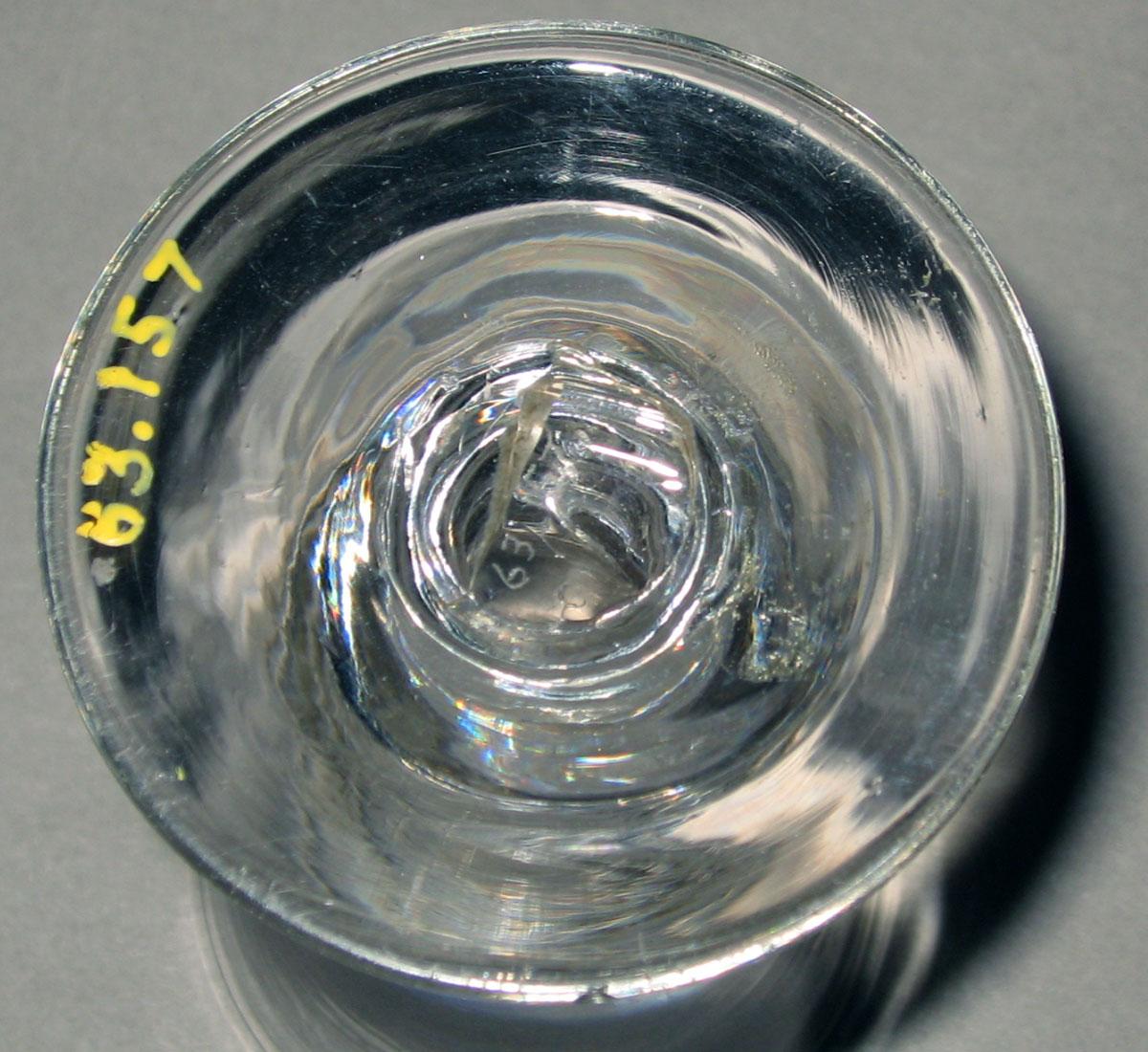 1963.0157 Colorless glass wineglass (underside)