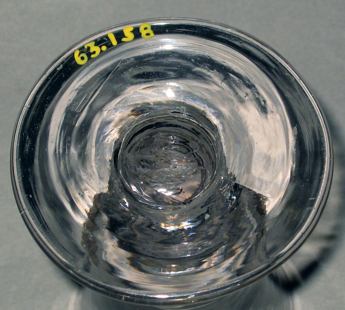 1963.0158 Colorless glass wineglass (underside)