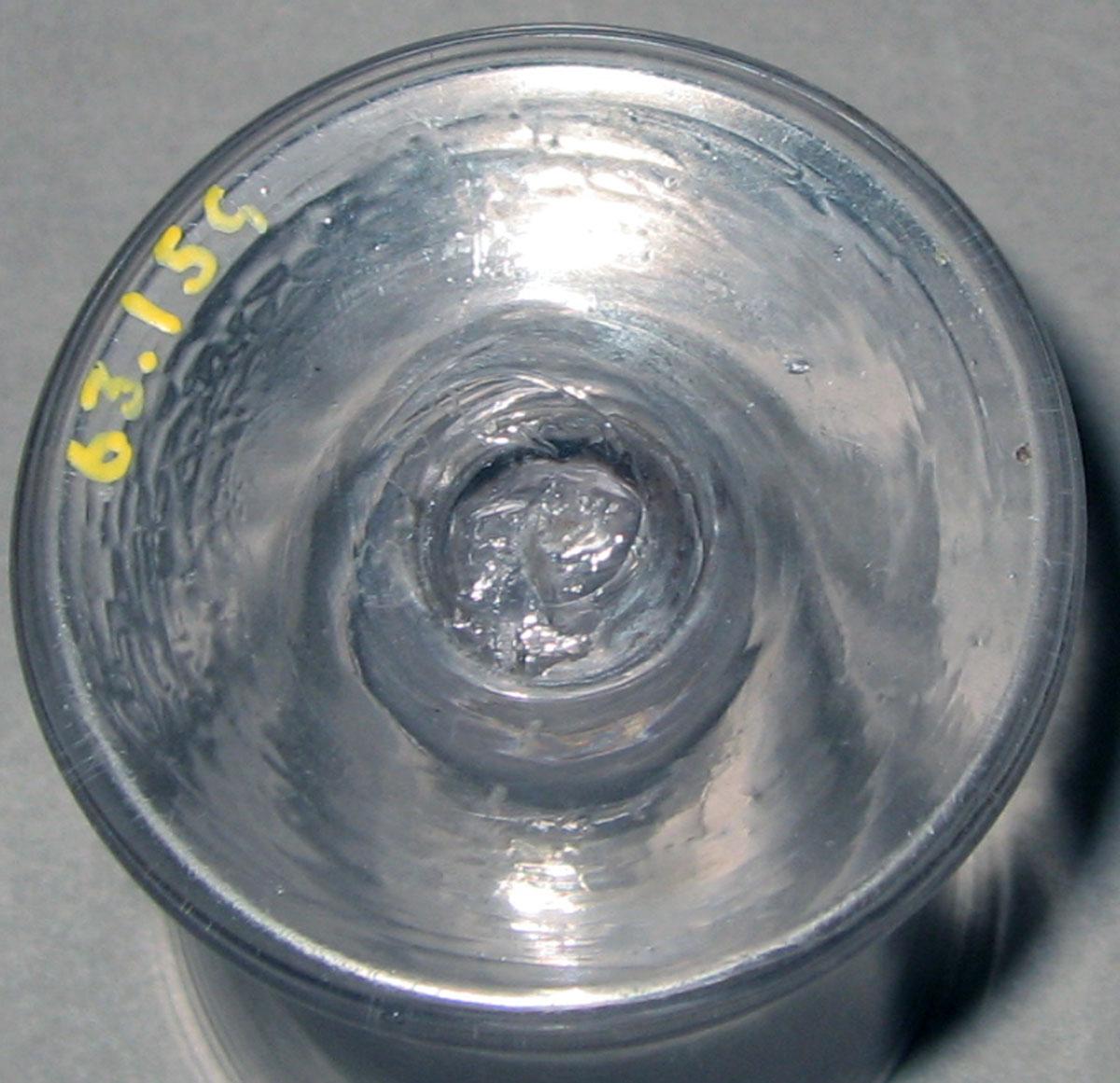 1963.0159 Colorless glass wineglass (underside)