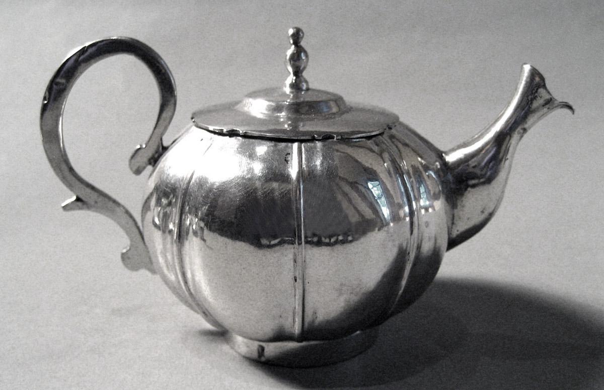 1955.0136.069 A, B Silver Teapot side 2