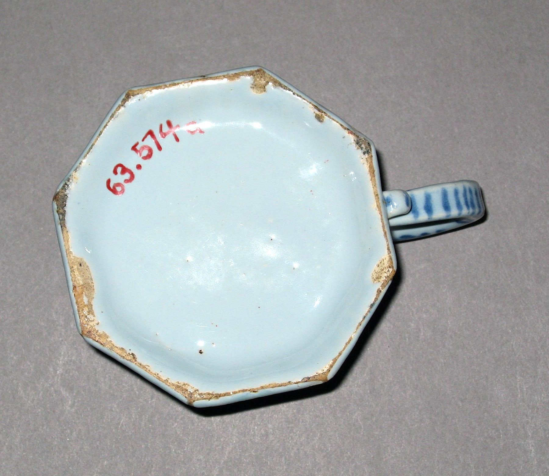 1963.0574 A Tin-glazed earthenware cream pot (underside)