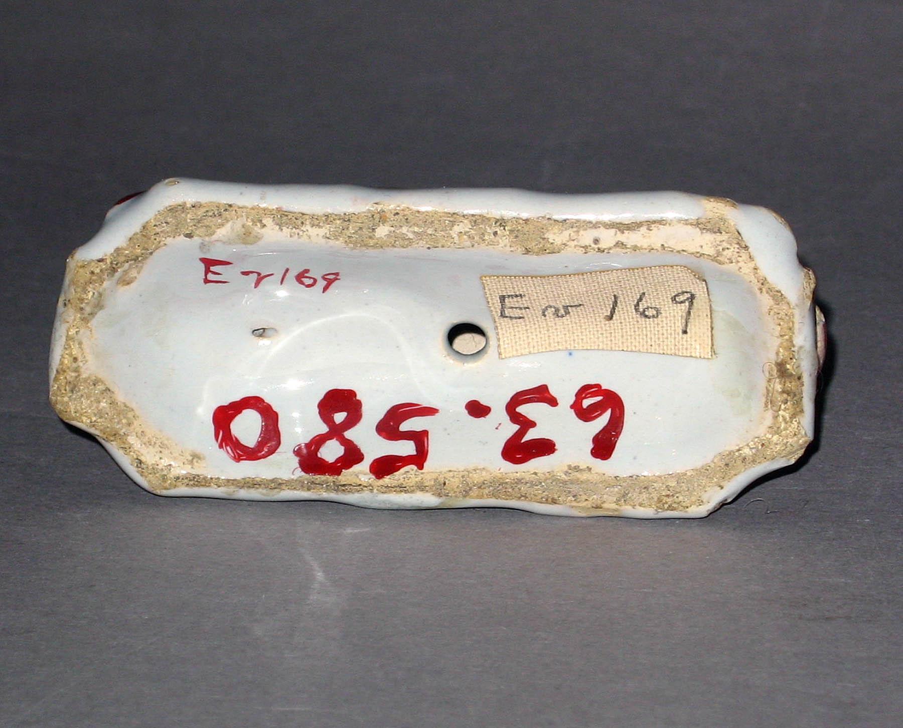 1963.0580 Earthenware figure (underside)