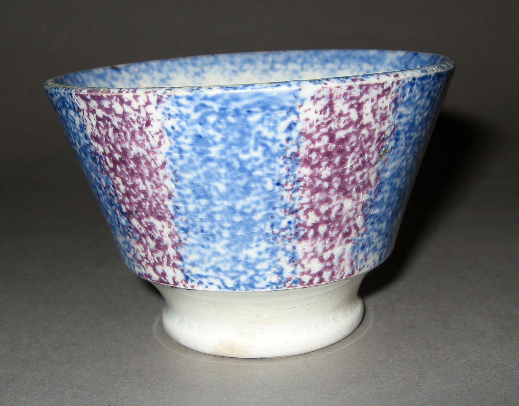 1963.0588 Blue and purple stripe spatterware teabowl